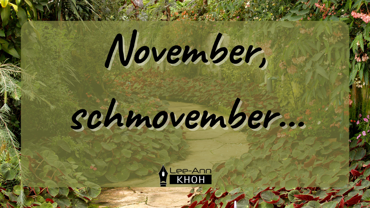 Text reads: November, schmovember. Background contains a lush green garden and a winding path.